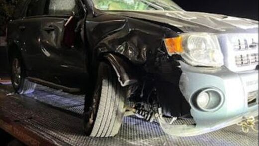A picture of an SUV involved in an accident.